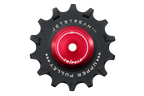 A black bicycle chain guard sprocket with a bright red center anodized hub, featuring white printed text that reads 'JETSTREAM PRO' and 'UPPER PULLEY' with 'TRIP EAK' in the center. The product is isolated on a solid white background.