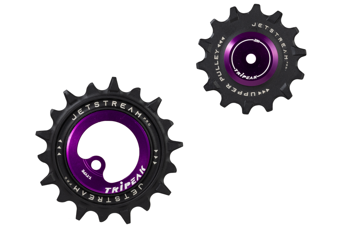 Two bicycle chainrings from the Jetstream 46 series by Tripeak, featuring a black outer ring and a vibrant purple center anodized face with white branding.