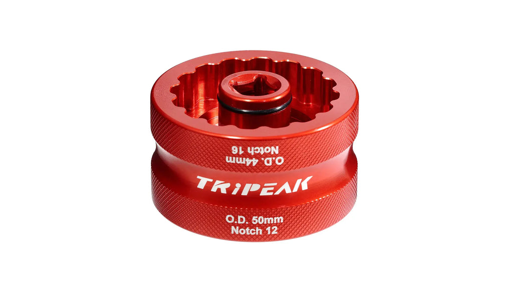 Red metal component with 'Tripeak' branding on a white background