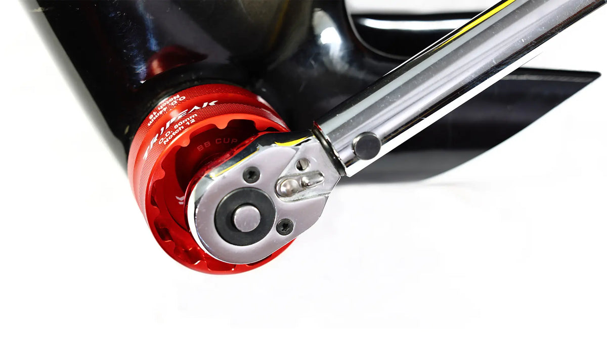 Close-up of a red and silver tool on a white background