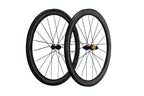 Two black carbon fiber road bicycle wheels with thin spokes and a gold hub accent, shown against a solid white background.