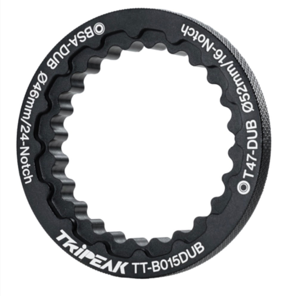 A black Tripeak bicycle chainstay spacer ring with white printed text specifications, shown on a solid white background.